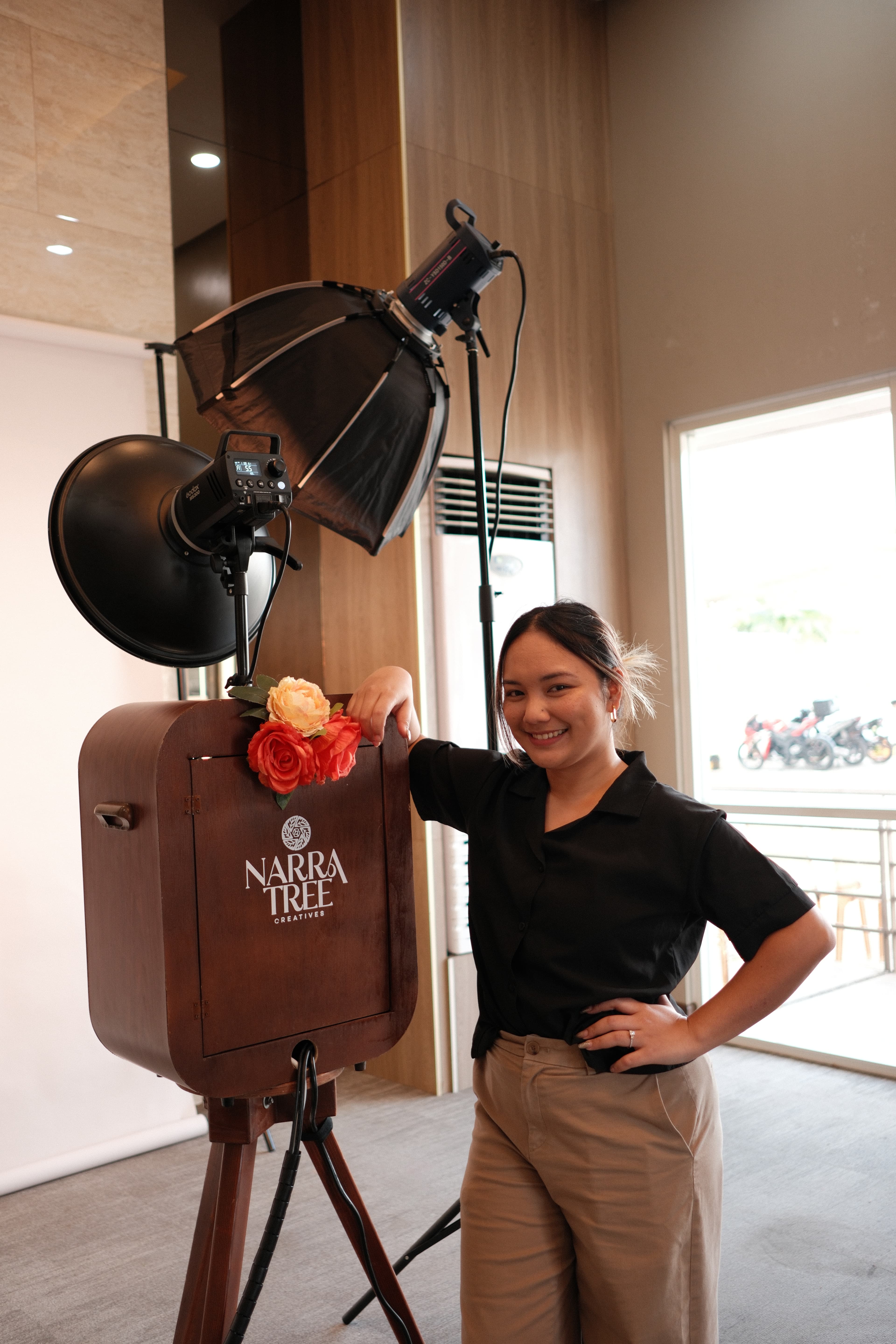 The founder of Narra Tree Creatives with the booth and ring light